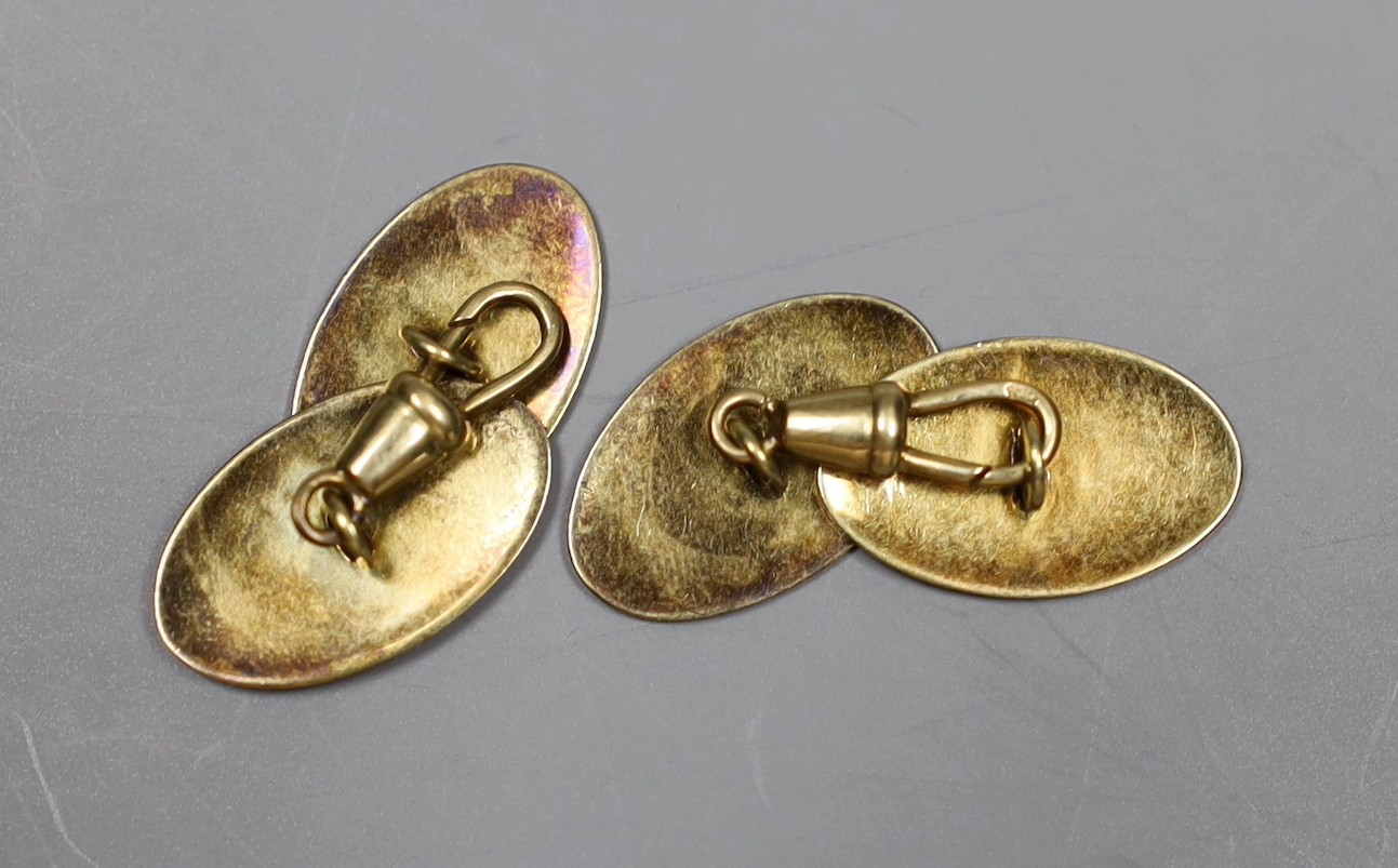 A pair of Austro-Hungarian 585 yellow metal oval cufflinks